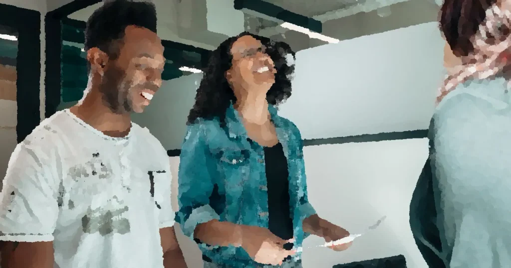 Smiling couple discussing with an advisor in a modern office setting.