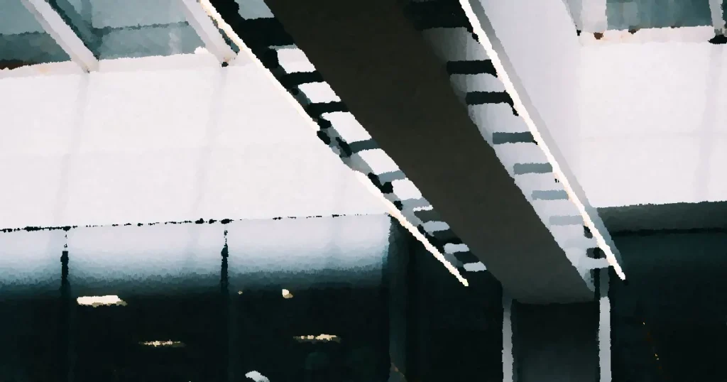 Modern architectural detail showcasing a bridge with glass facade and sleek design.