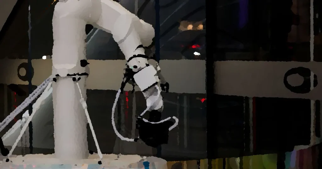 A white robotic arm operating indoors with a modern design and advanced technology.