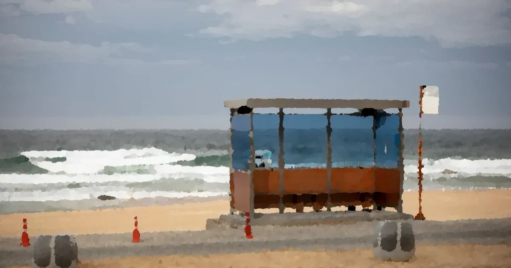 A solitary bus stop by the sea on a cloudy day in Gangneung-si, South Korea.