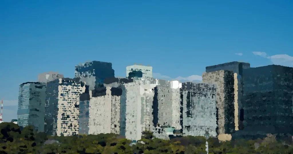 City skyline featuring modern skyscrapers under a clear blue sky.