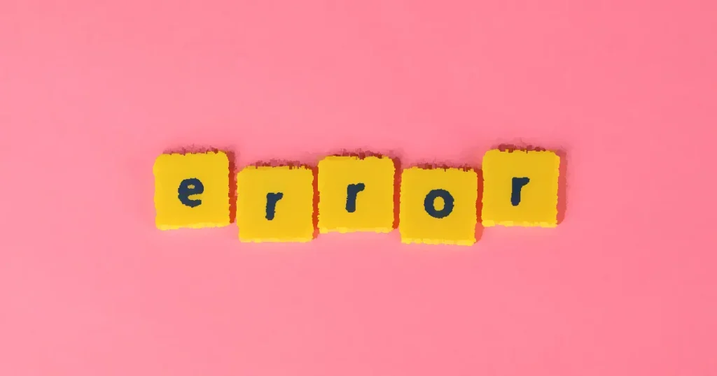Yellow block letters spelling 'error' on a vibrant pink background, capturing a playful message.