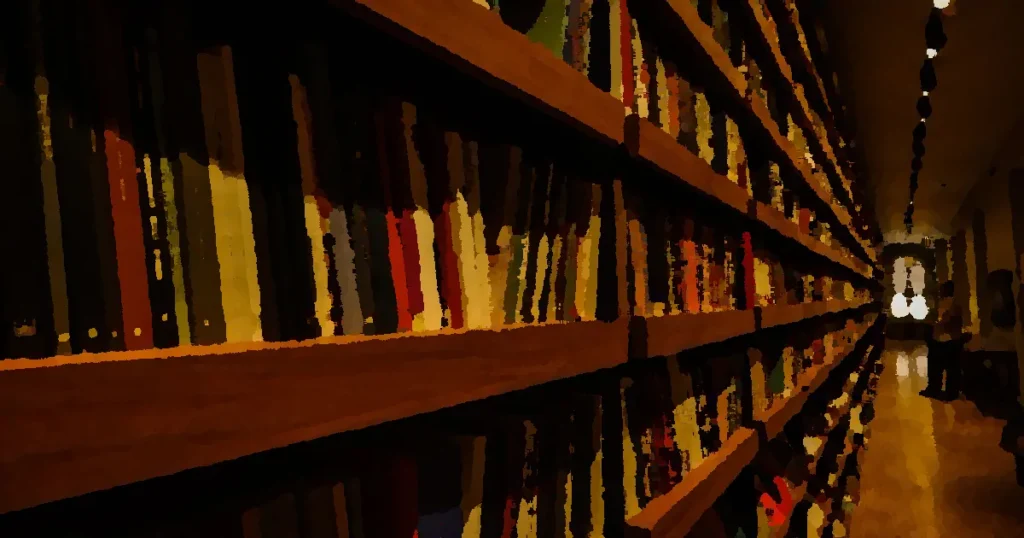 Long shelves filled with books in a warmly lit library interior, ideal for reading enthusiasts.