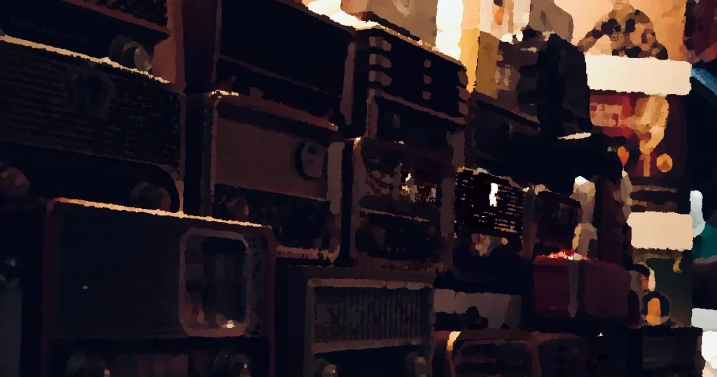 A nostalgic collection of vintage radios captured in warm ambient lighting.