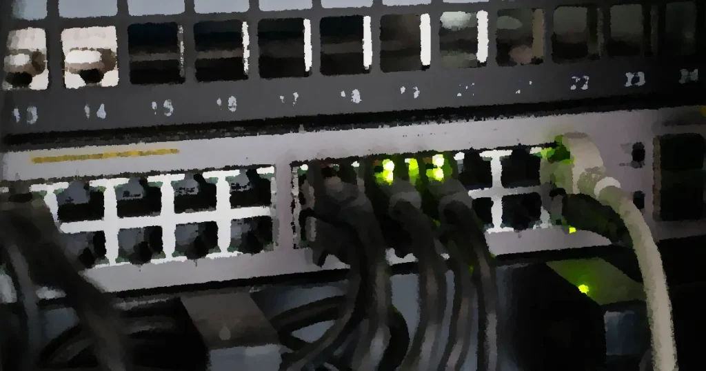 Networking equipment with connected cables, showcasing modern technology infrastructure.