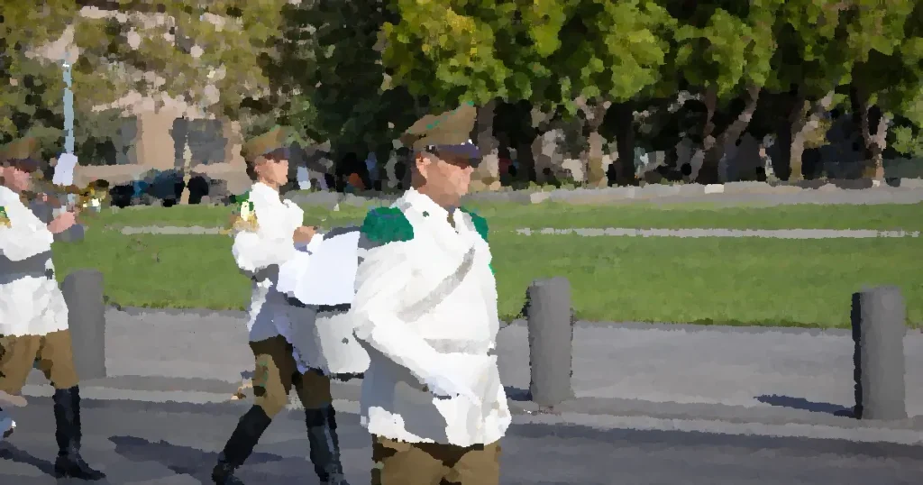 Chilean national police band performing in public parade in Santiago, Chile. Formal uniforms and instruments displayed.