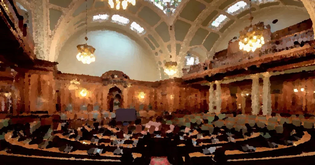 A beautifully designed chamber room with ornate woodwork and chandeliers in the UK.