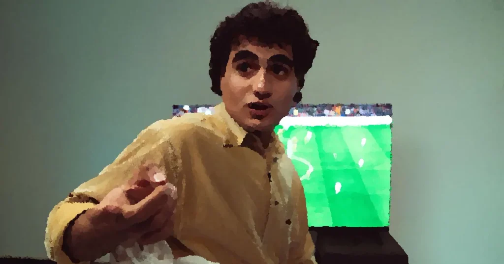 A man engaged in watching a soccer game on TV, expressing emotions.
