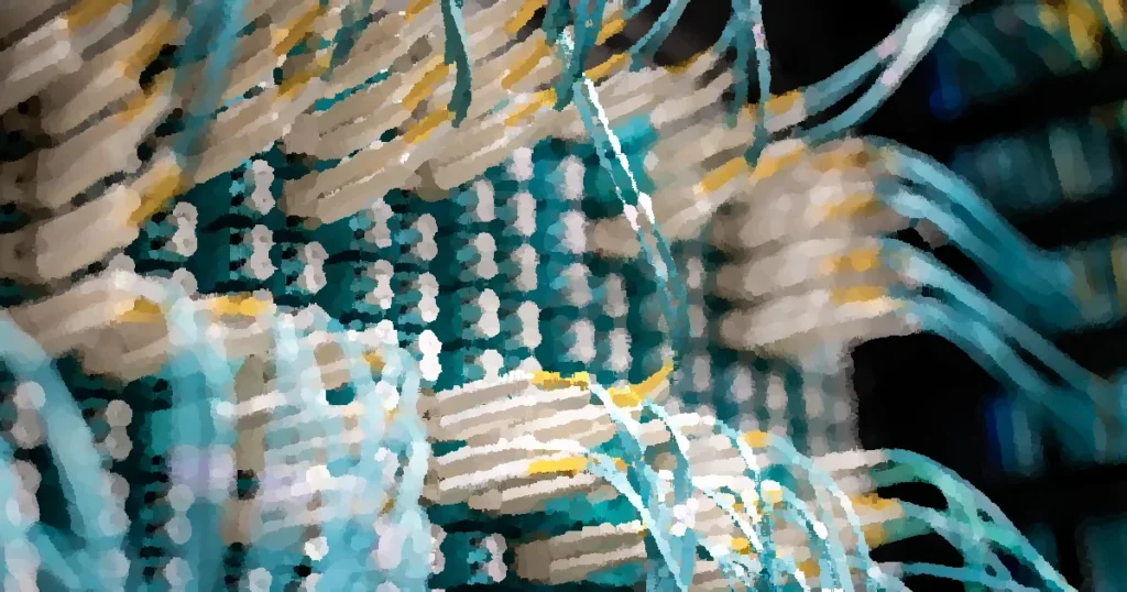 From below of fiber optic switch with sockets and connected rubber cables on blurred background