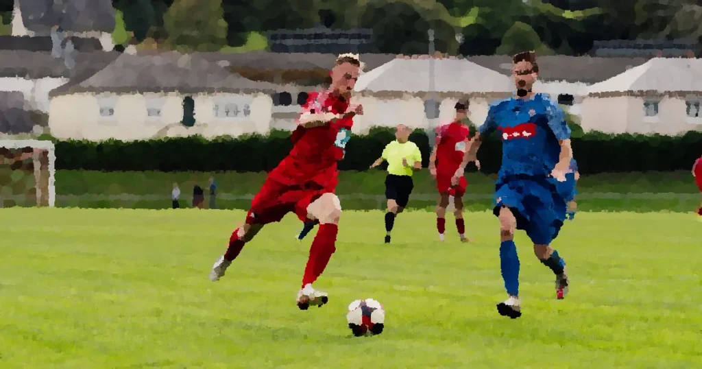 Action shot of soccer players competing on a lush green field outdoors.