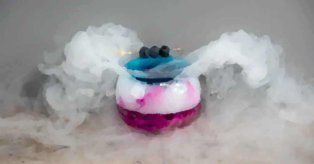 Artistic cocktail presentation with berries and smoke on gray background.