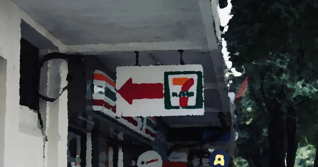 7-Eleven convenience store sign and storefront, open 24 hours in an urban setting.