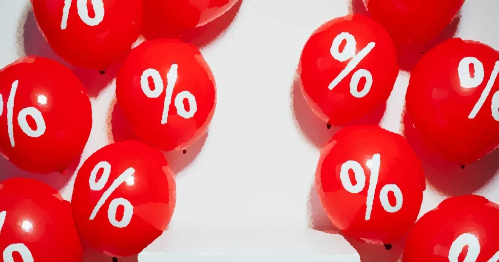 Red balloons with percentage signs, ideal for marketing promotions and sales events.