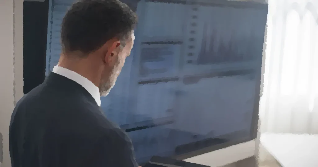 Professional analyzing stock markets on a digital tablet in a modern office setting.