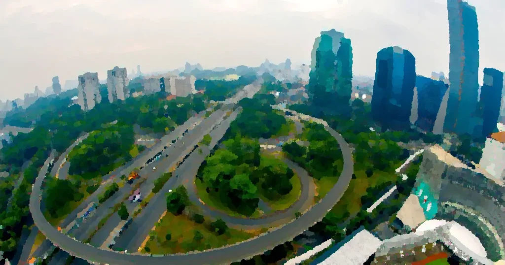 Dynamic aerial shot of Jakarta's skyline showcasing modern skyscrapers and busy highways.