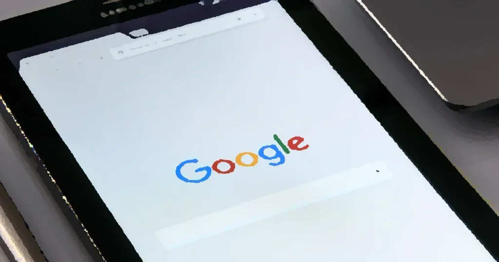 Close-up of a tablet displaying Google's search screen, emphasizing technology and internet browsing.
