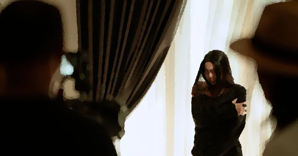 A woman actor performing a scene indoors, captured with dramatic lighting and intense emotion.